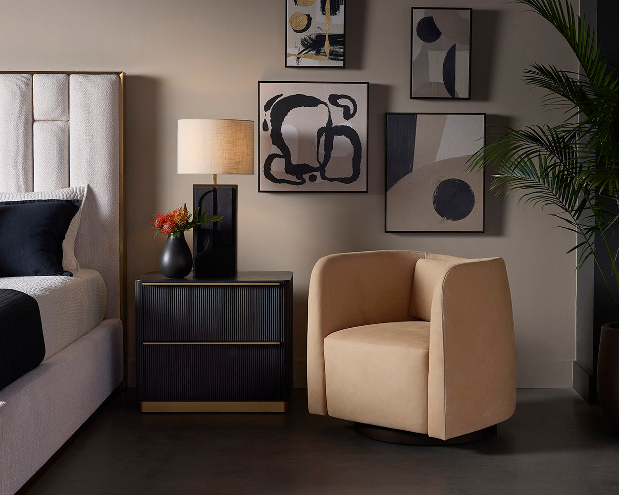 Kalla Nightstand in charcoal styled beside a bed and accent chair