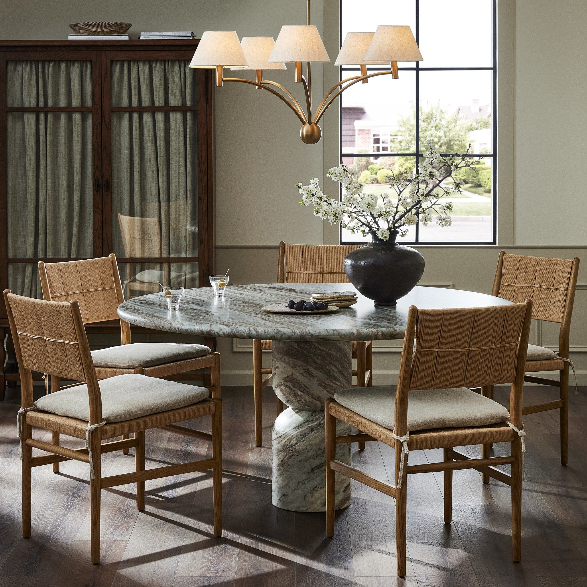 Figueroa Round Dining Table 60in in Sawar Marble styled in a dining room