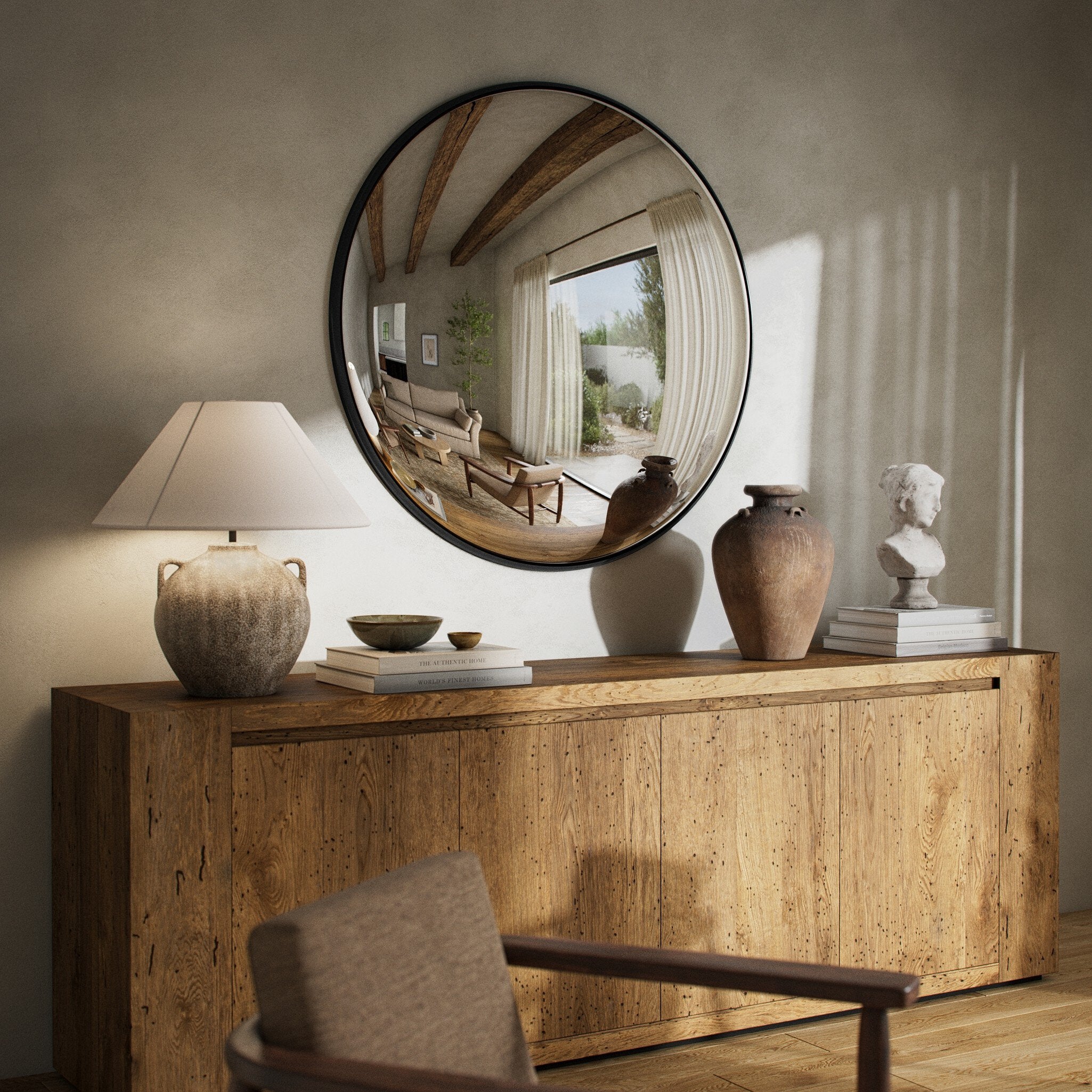 Convex Wall Mirror in Iron Matte Black styled above a console