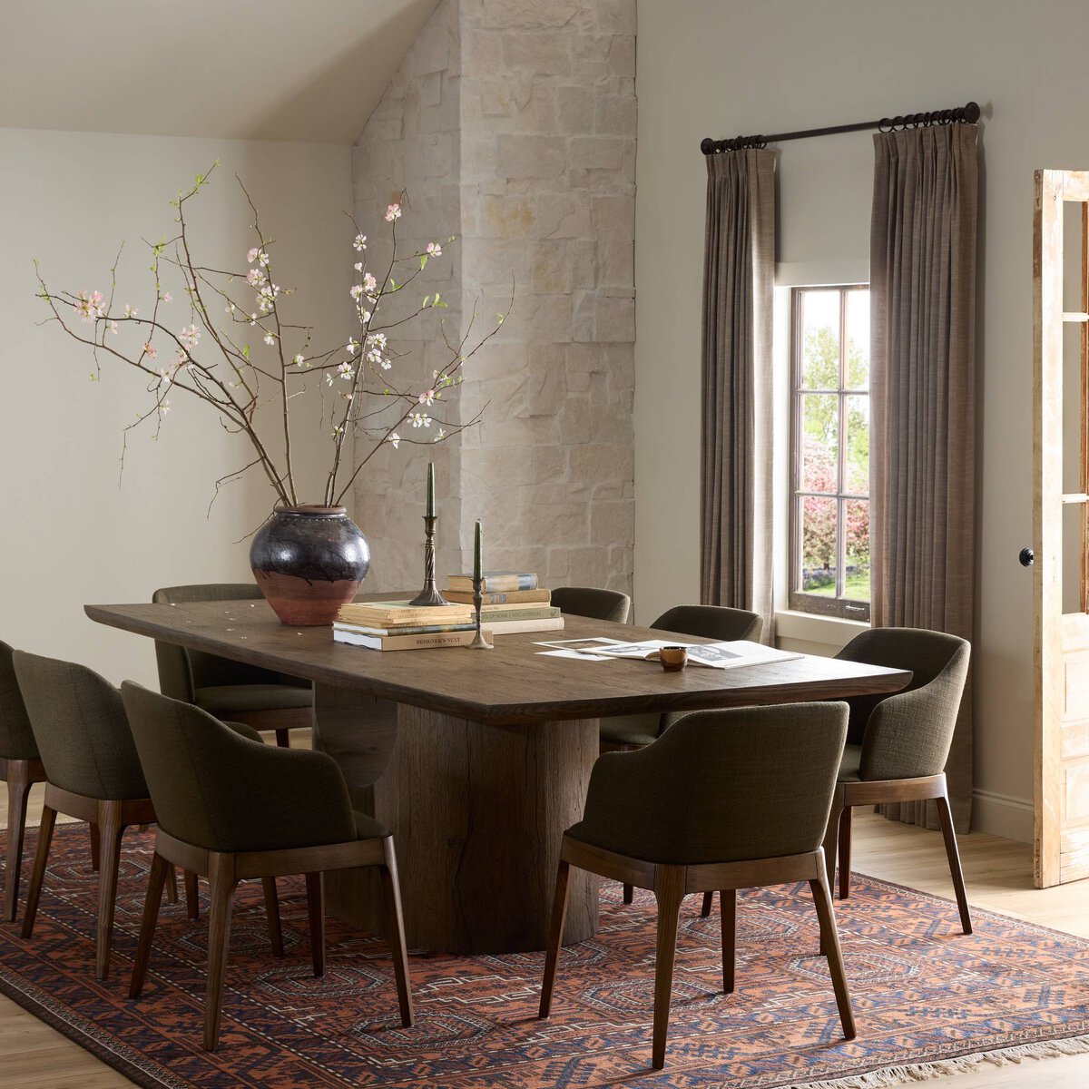 Beive dining table in brown oak veneer, shown in a dining room setting