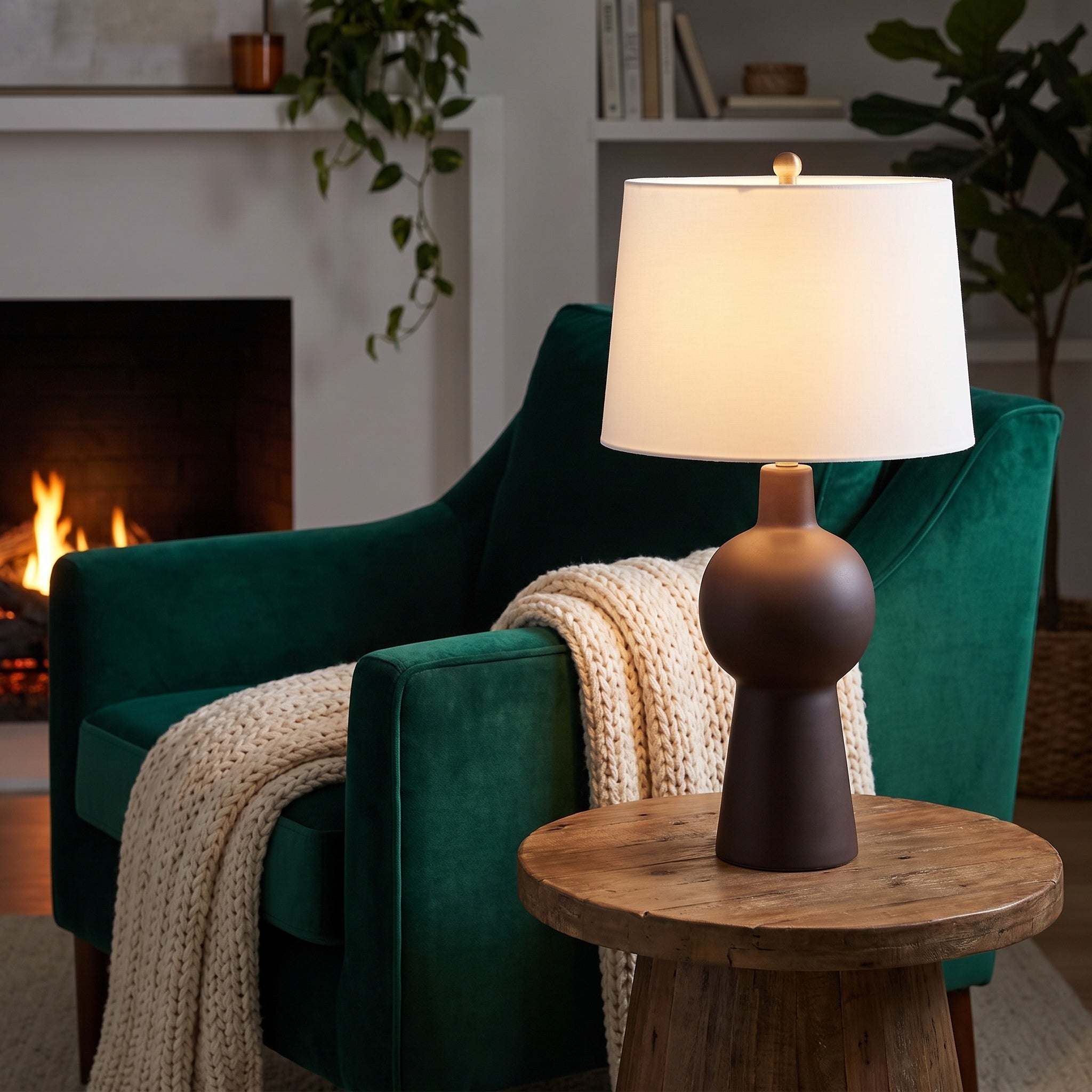 Groton Table Lamp beside a green armchair