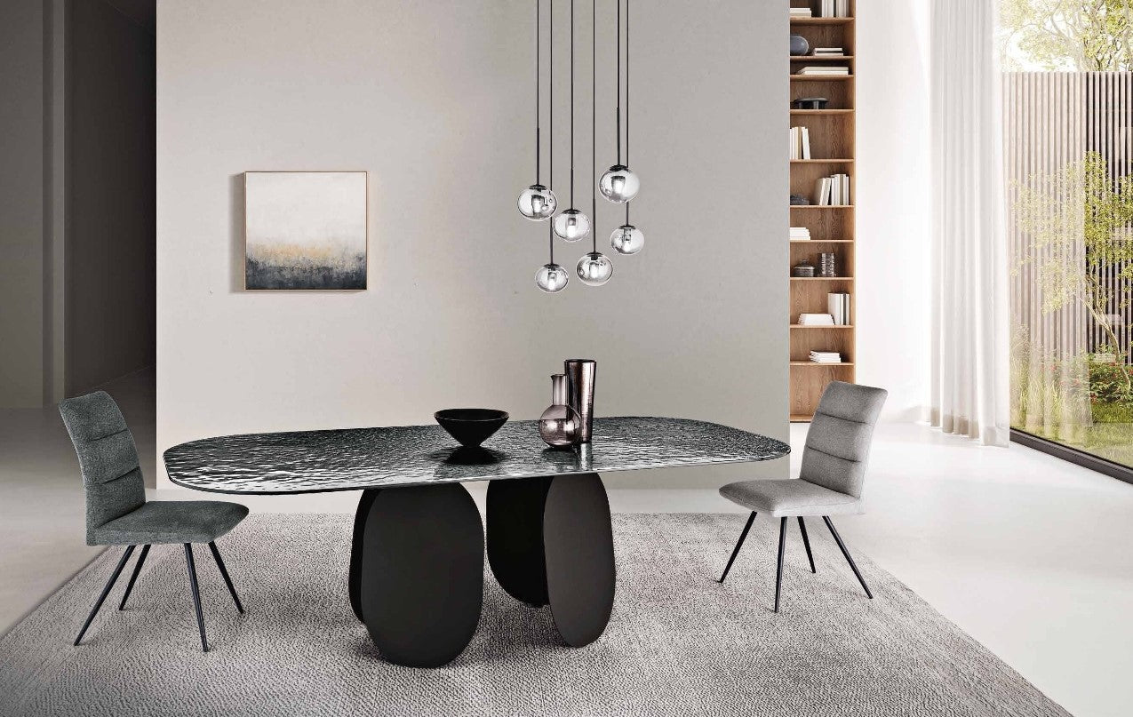 Maya Dining Table - Hammered Smoke Glass in a dining room