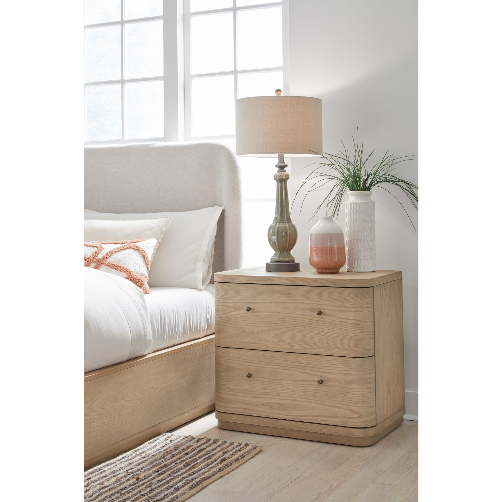 Penny 2-Drawer Nightstand styled beside a bed